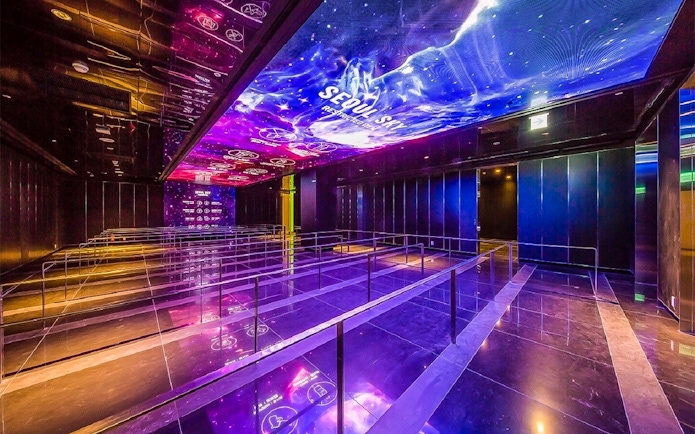 Queue area with illuminated ceiling at Lotte World Tower Seoul Sky.