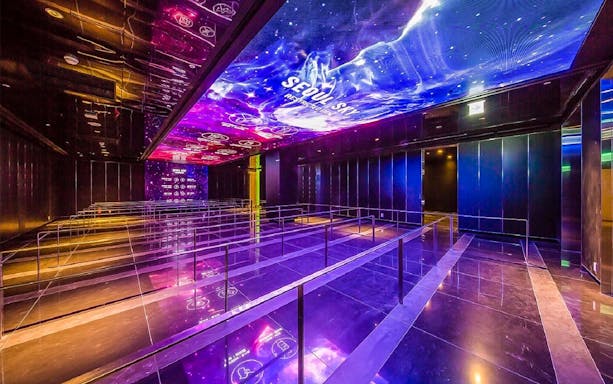 Queue area with illuminated ceiling at Lotte World Tower Seoul Sky.