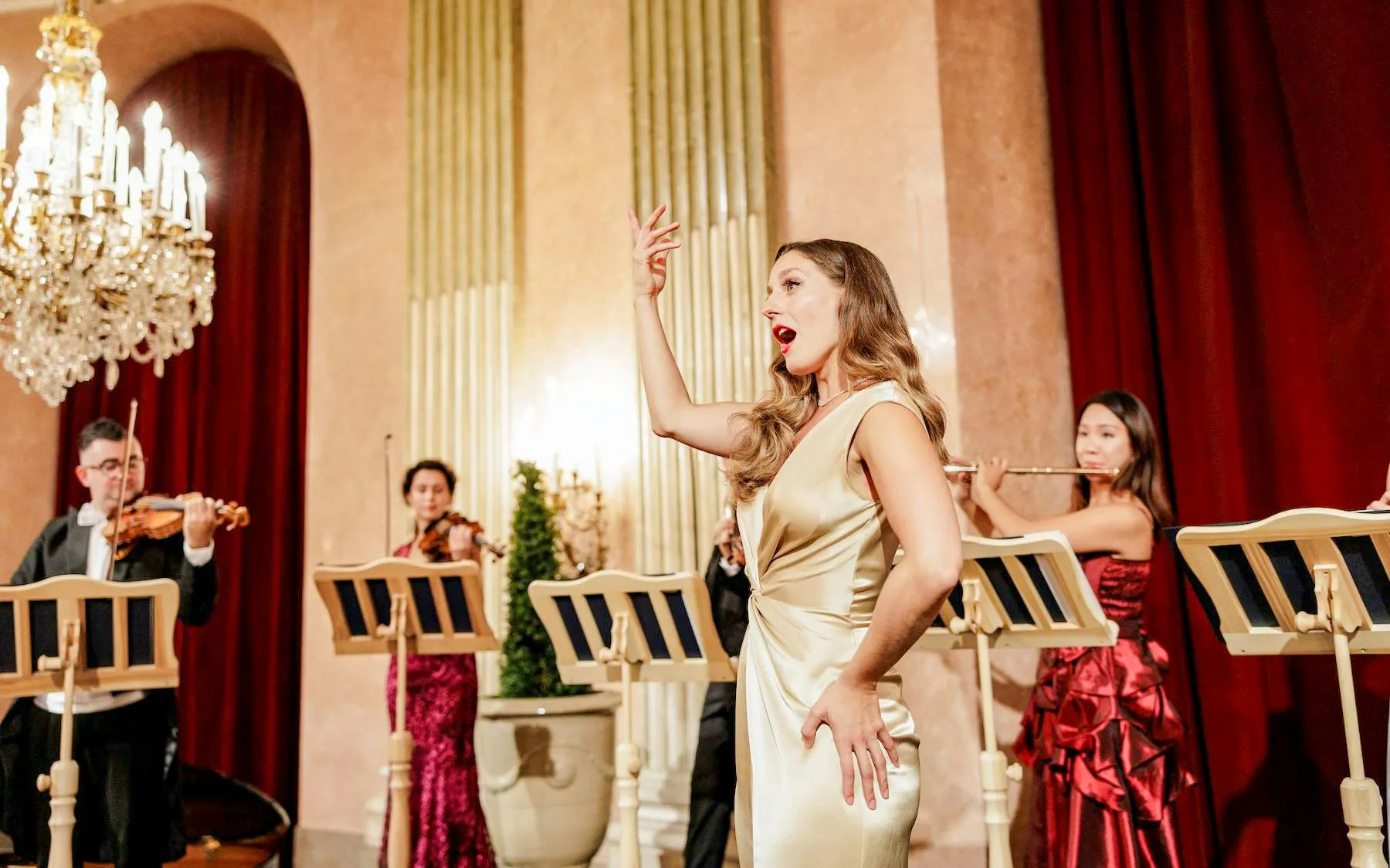 Opera singer performing with musicians at Imperial Gala Concert, Palais Auersperg, Vienna.