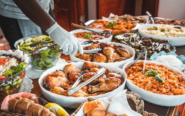 Buffet spread with grilled chicken, pasta, salad, and bread on Athens sunset dinner cruise.