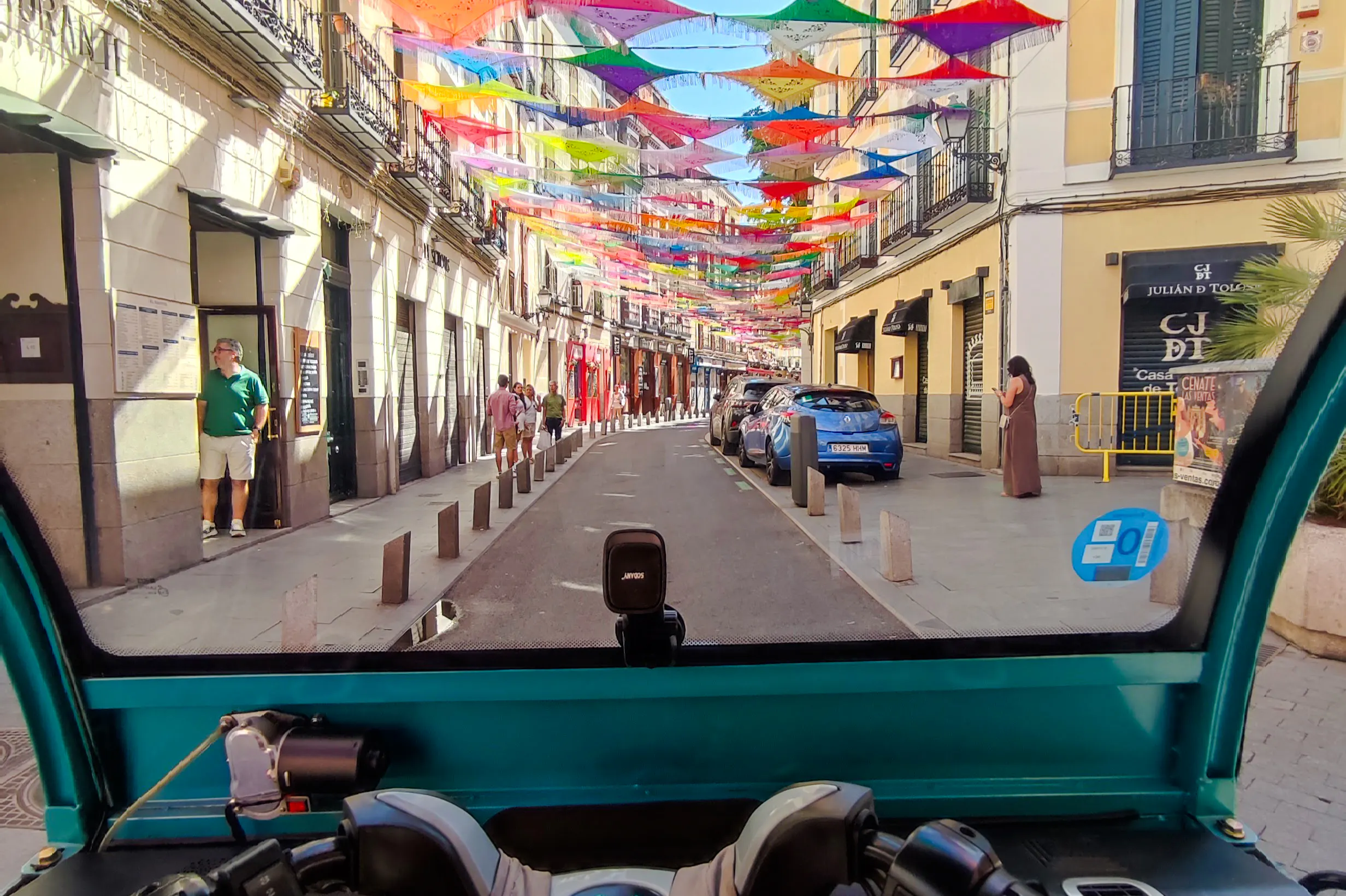 Colorful street view from a tuk-tuk during a private 2-hour tour in Madrid with a local guide.
