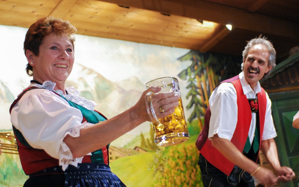 Traditional Tyrolean performers with beer stein at Gundolf Family Folk Show.