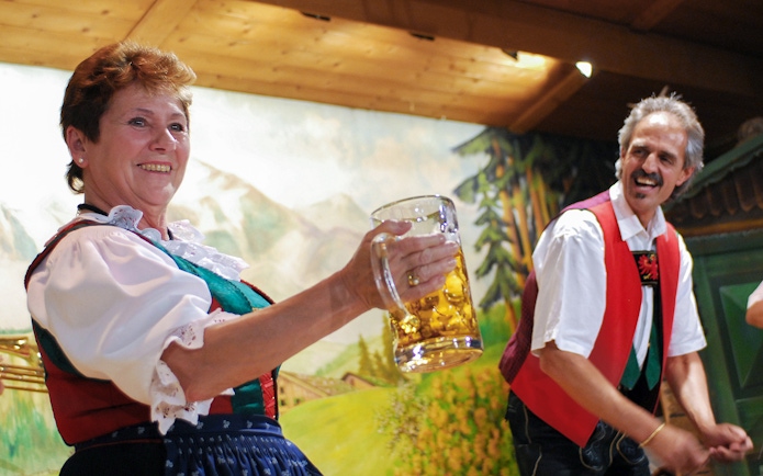 Traditional Tyrolean performers with beer stein at Gundolf Family Folk Show.