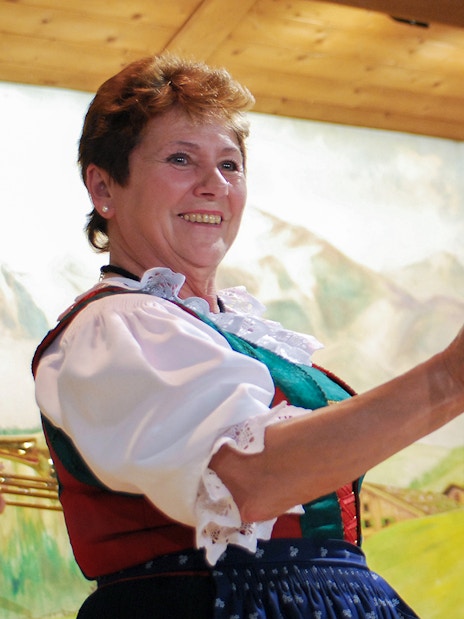 Traditional Tyrolean performers with beer stein at Gundolf Family Folk Show.
