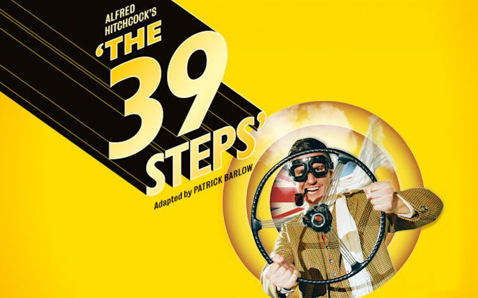 The 39 Steps" play poster with a man in goggles holding a steering wheel.