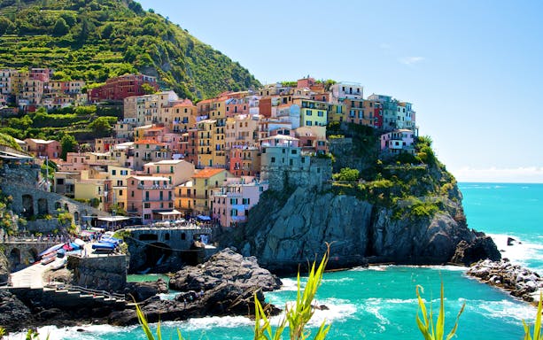 Colorful hillside village of Manarola in Cinque Terre, Italy, overlooking the sea.