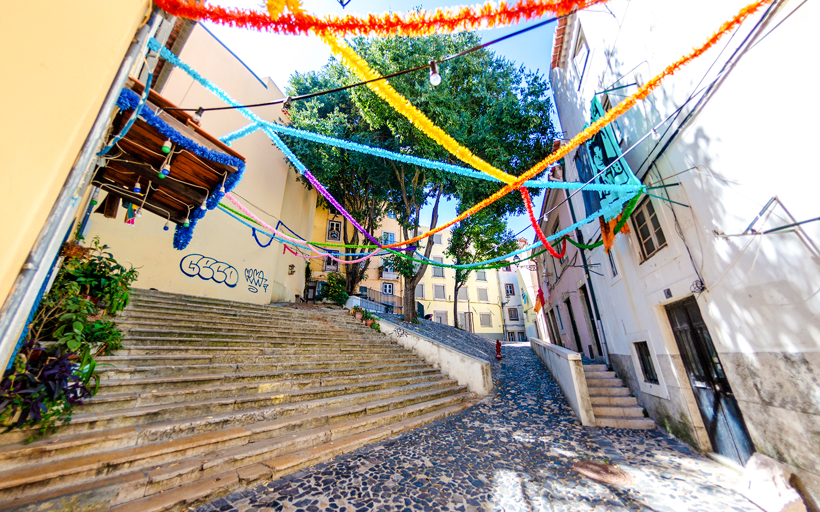 Colorful streamers over steps in Mouraria, Lisbon, Portugal.