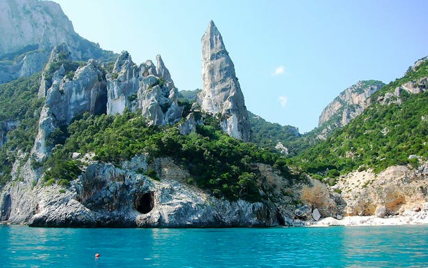 Rocky cliffs and turquoise sea at Costa di Baunei, Sardinia.