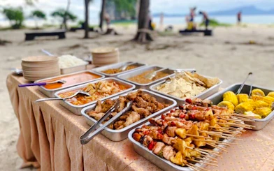 BBQ dinner spread on a beach during Krabi 7 Islands Sunset Tour.