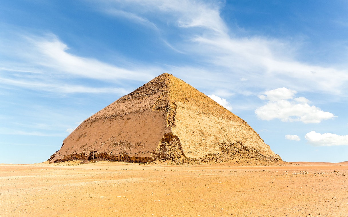 Bent Pyramid in Dahshur under a clear blue sky.