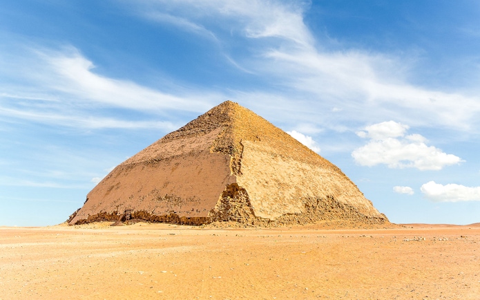 Bent Pyramid in Dahshur under a clear blue sky.