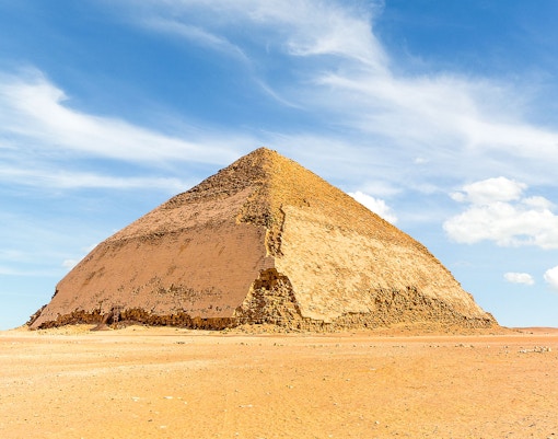 Bent Pyramid in Dahshur under a clear blue sky.