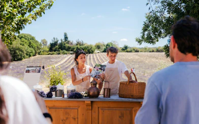 Tour guides demonstrating lavender distillation at Terre Ugo, Provence.