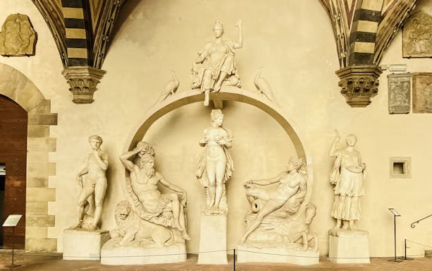 Statues depicting mythological figures inside Bargello Museum, Florence.