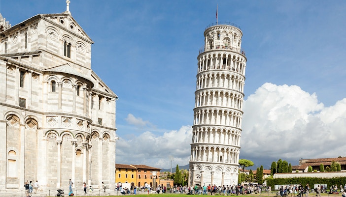 Tour group exploring during visit to the Leaning Tower of Pisa