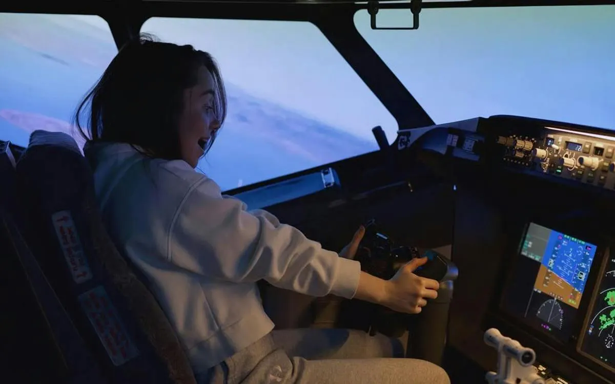 Person experiencing Boeing 737 flight simulator in Istanbul cockpit.