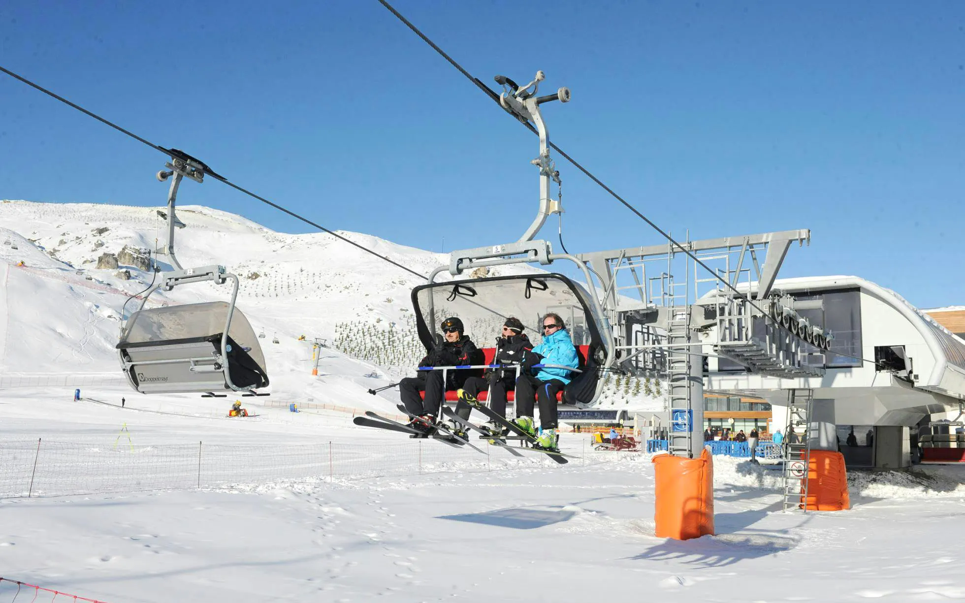 Skiers on a chairlift at Shahdag Mountain Resort during Guba-Shahdag Tour.