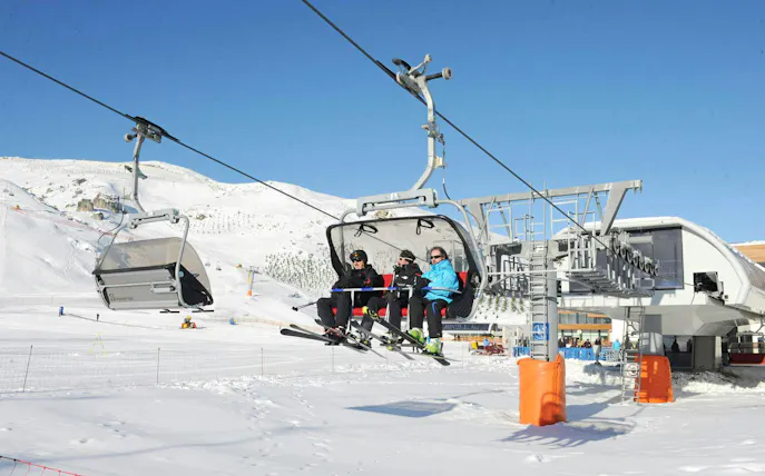 Skiers on a chairlift at Shahdag Mountain Resort during Guba-Shahdag Tour.