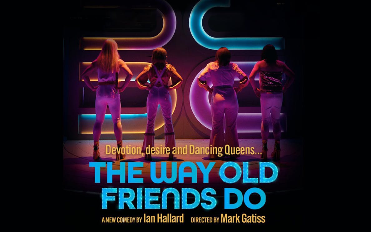 Performers on stage in colorful lighting for "The Way Old Friends Do" comedy show.