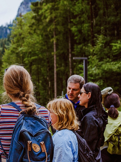Tour group with guide near Neuschwanstein Castle in Germany.
