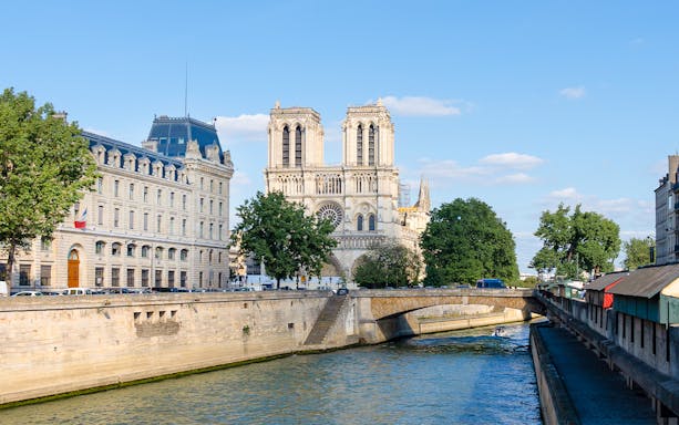 Seine River view with Notre-Dame Cathedral in Paris during morning cruise.