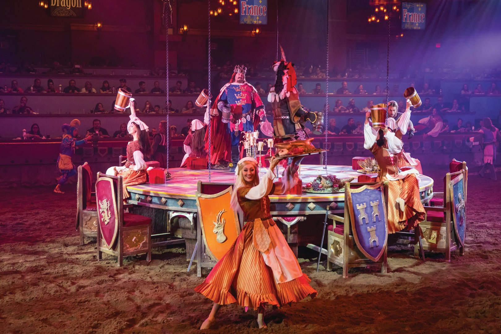 Knights and performers at Tournament of Kings show in Las Vegas arena.