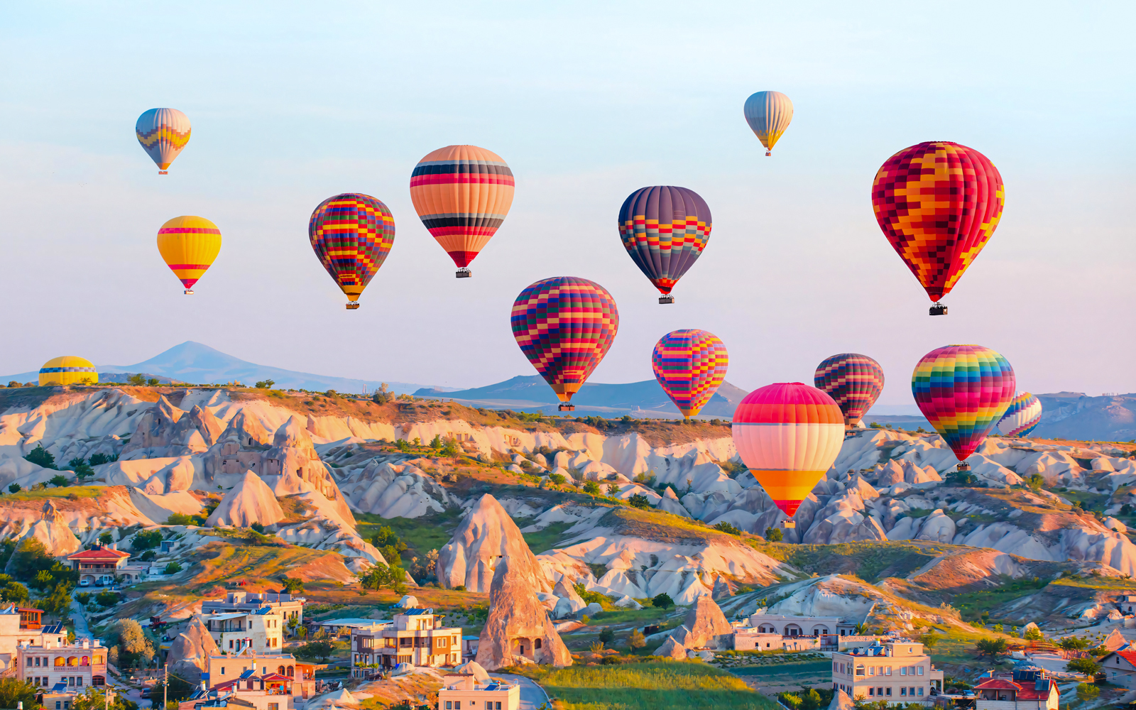 Hot air balloons over Cappadocia's unique rock formations, Turkey.