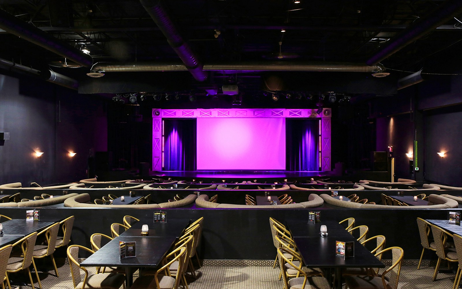 Theater setup for Evolution Magic Show with stage and seating area.