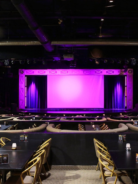 Theater setup for Evolution Magic Show with stage and seating area.