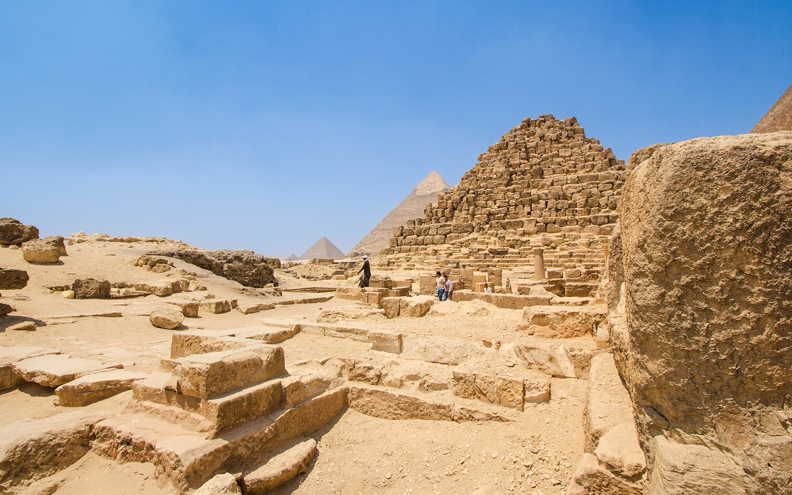 Giza Pyramid Complex with Khufu, Khafre, and Menkaure pyramids near Queen Hetepheres' tomb.