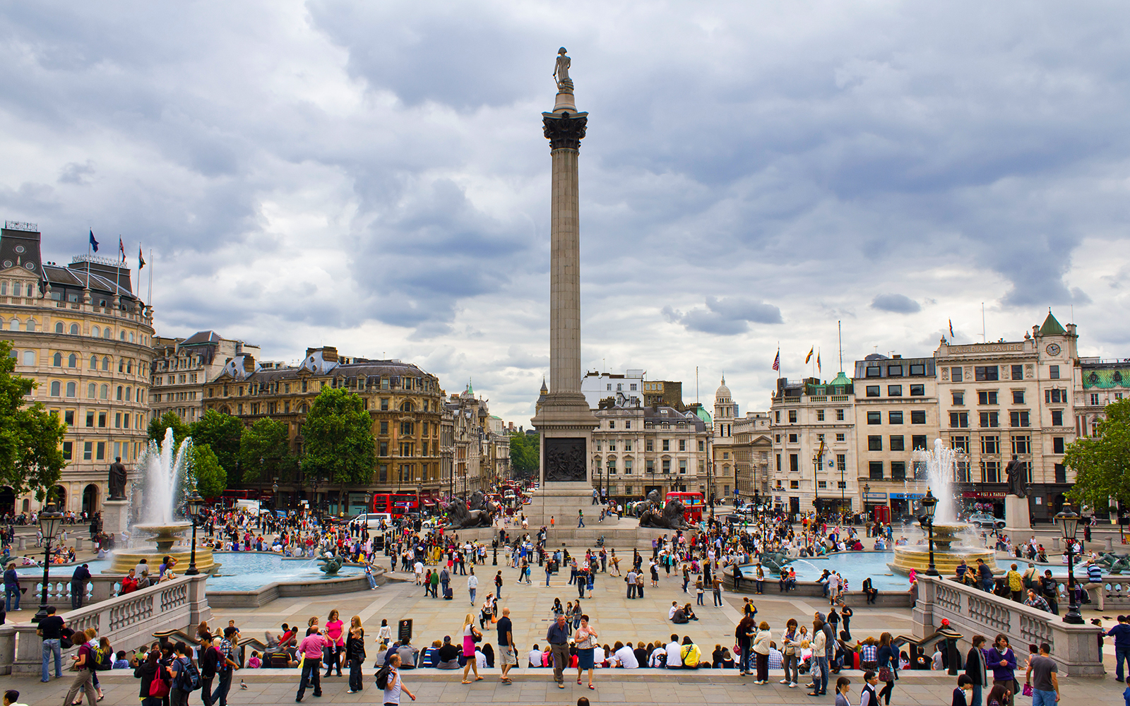 Trafalgar Square with Nelson's Column and fountains, view from Pall Mall East, London.