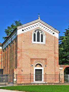 Scrovegni Chapel exterior with brick facade and arched windows in Padua, Italy.
