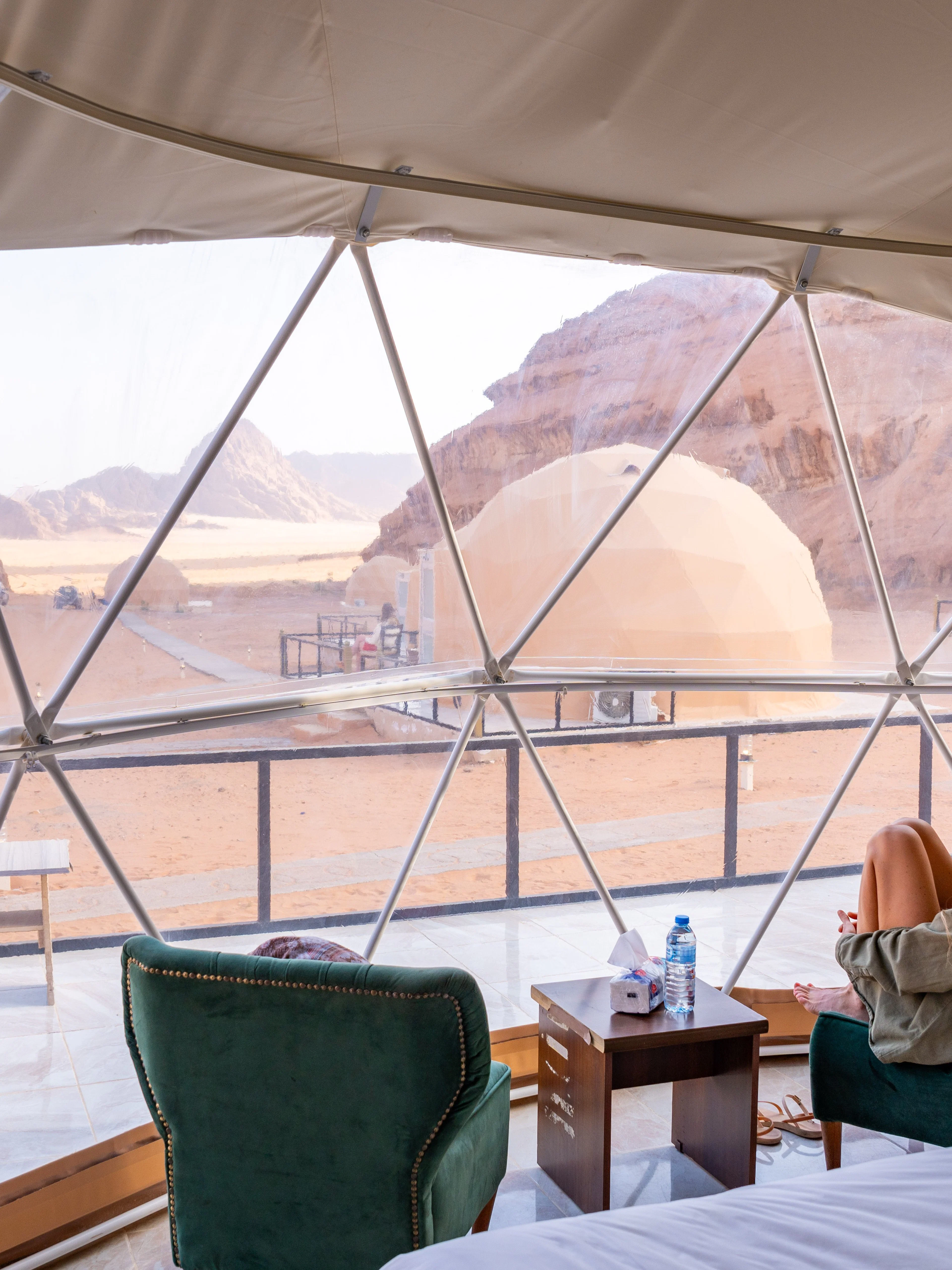 Geodesic dome tent interior with desert view at Wadi Rum.