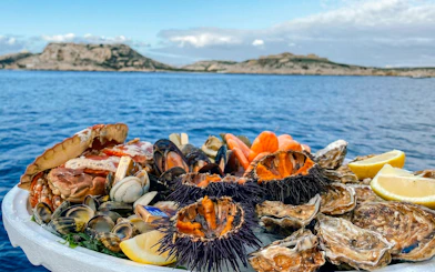 Seafood platter on excursion boat in Calanques de Cassis, France.