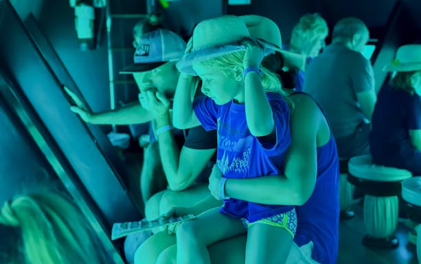 Family with kids viewing fish on Royal Seascope Submarine, Hurghada.