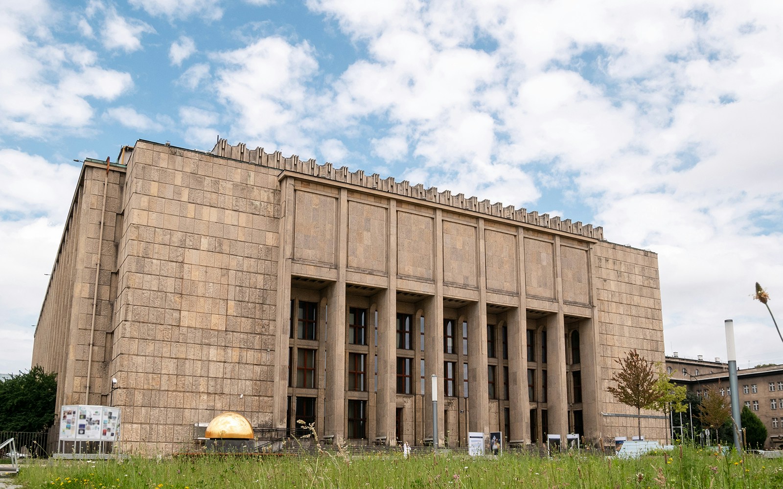 National Museum Krakow exterior with visitors exploring the entrance area.