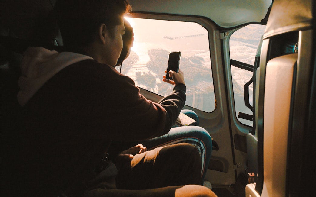 Guests in helicopter viewing Niagara Falls below.