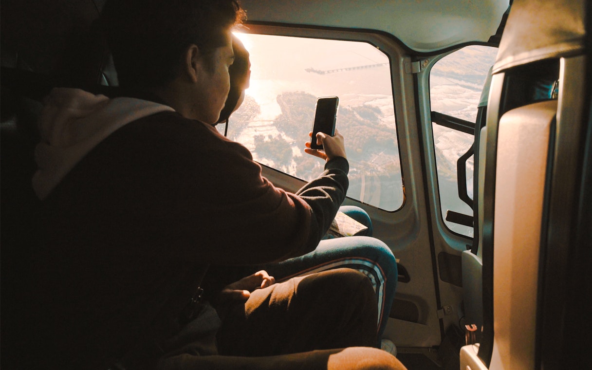 Guests in helicopter viewing Niagara Falls below.