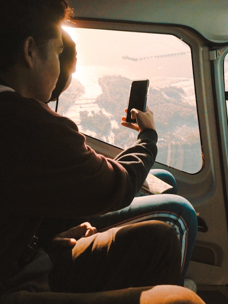 Guests in helicopter viewing Niagara Falls below.