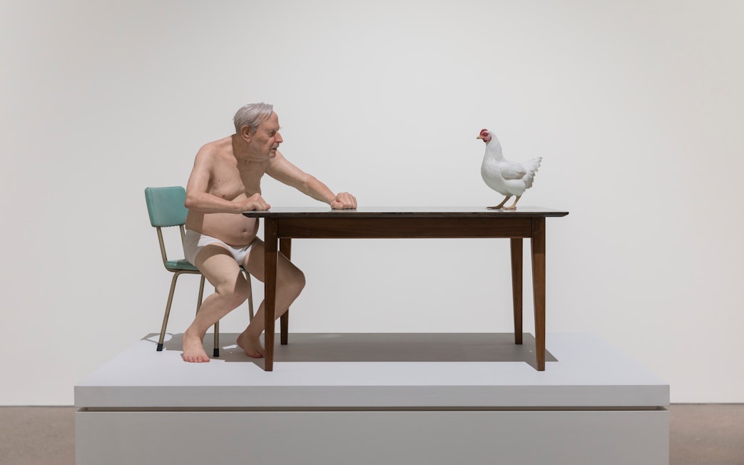 Man and chicken sculpture by Ron Mueck at Art Gallery of New South Wales, Sydney.