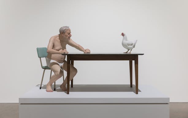 Man and chicken sculpture by Ron Mueck at Art Gallery of New South Wales, Sydney.