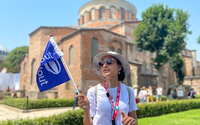 Tour guide leading a group at Topkapi Palace Museum, Istanbul, with skip-the-line access.