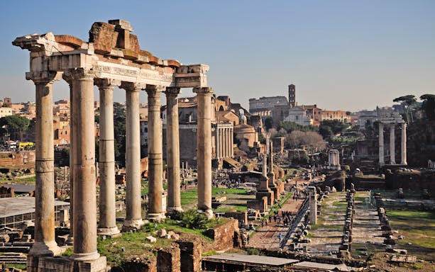 Roman Forum ruins with ancient columns, Rome sightseeing tour.