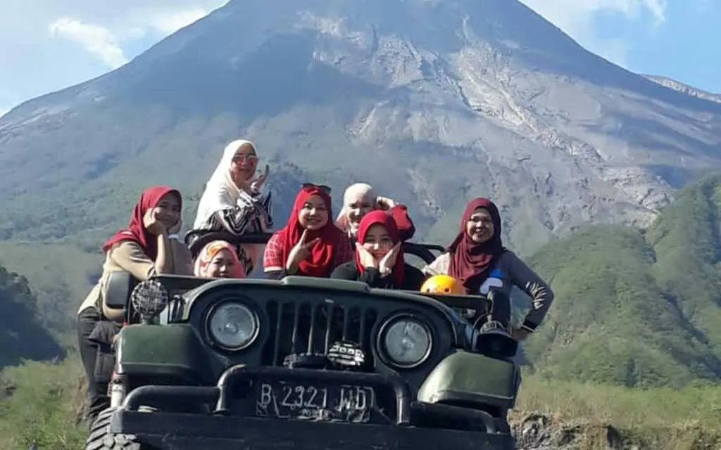 Jeep tour group at Merapi Volcano with mountain backdrop, Dubai tour.