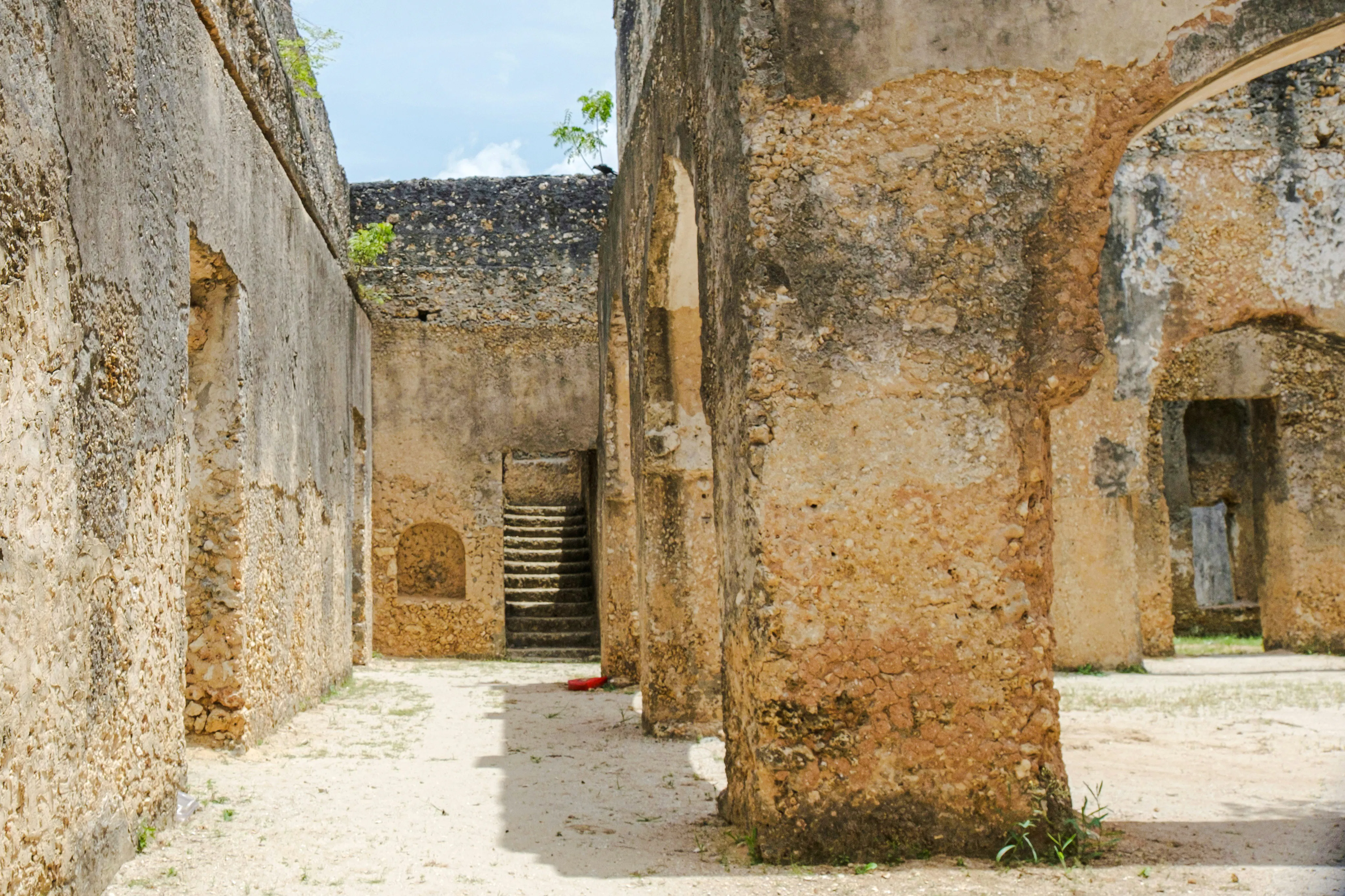 Stone Town ruins with stone walls and staircase, part of Zanzibar full-day tour.