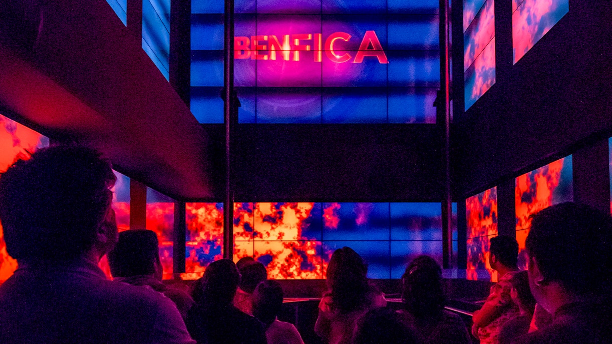 Benfica Stadium museum virtual lift experience with colorful digital displays.