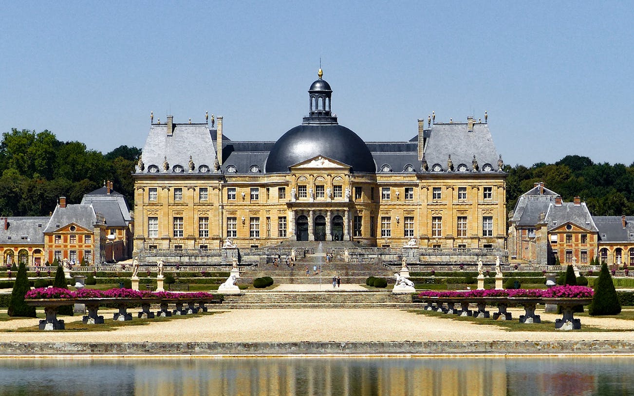 Château of Vaux-le-Vicomte with gardens and reflecting pool in France.