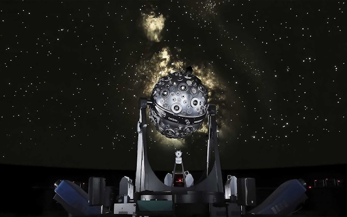 Planetarium projector under a starry sky at Lisbon Navy Planetarium.