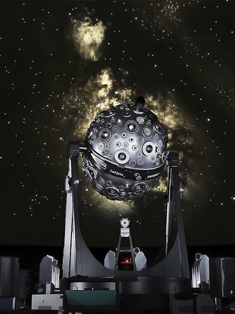 Planetarium projector under a starry sky at Lisbon Navy Planetarium.