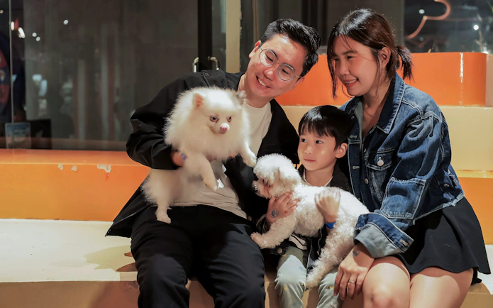 Family enjoying time with dogs at Just Pets Megastore.
